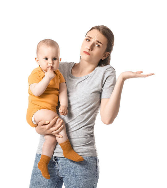 Upset young mother with little baby on white background - Foto, Bild
