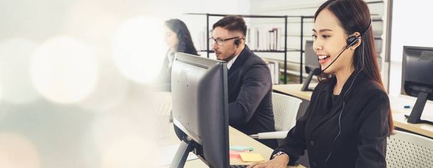 Business people wearing headset working in office broaden view - Фото, изображение