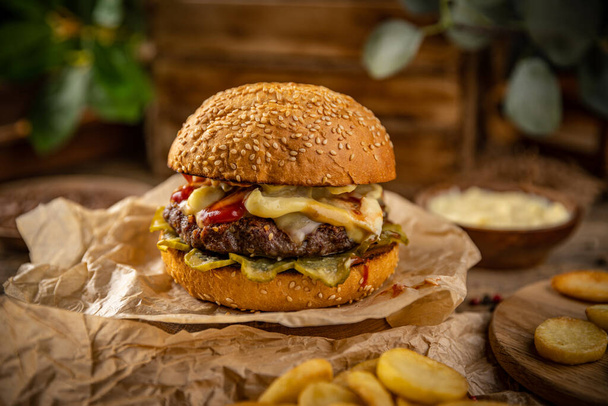 Delicious grilled burger. Fast food and junk food concept - Fotoğraf, Görsel