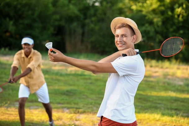 Young men playing badminton  outdoors - Photo, Image