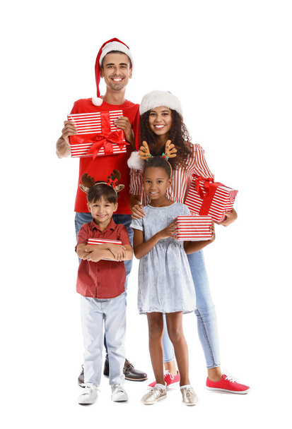 Happy family with Christmas presents on white background - Фото, зображення