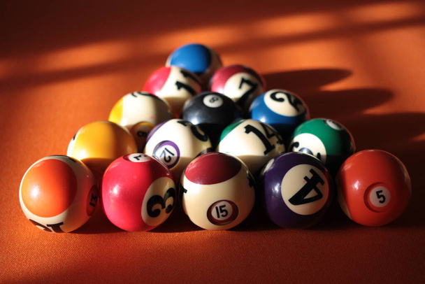 Pool balls pyramid on orange cloth for eightball game - Foto, Imagem