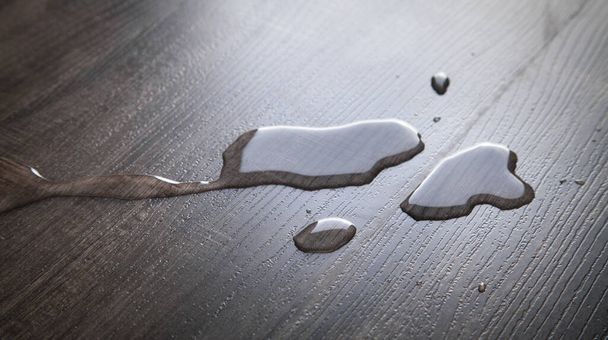 Drops of water on laminate floor. - Foto, Imagen
