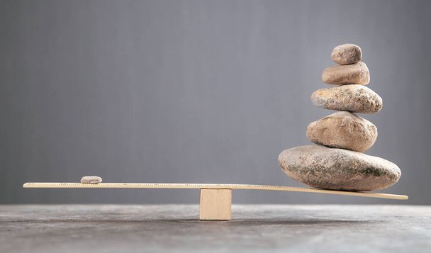 Balance stones on wooden scales. - Photo, Image