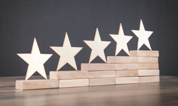 Wooden 5 stars on wooden block. Increase rating - Fotografie, Obrázek