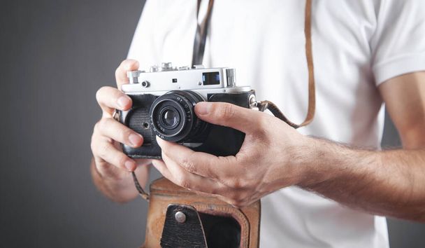 Man holding old retro camera. - Photo, Image