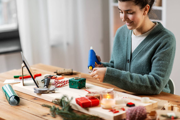 woman making advent calendar on christmas at home - 写真・画像