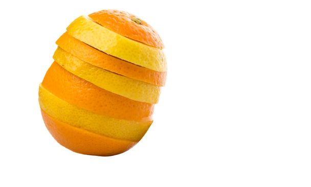 Orange and lemon fruit layer slices over white background - 写真・画像