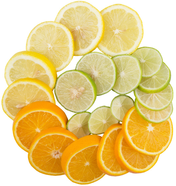 ライム、レモン、オレンジ色の層のスライス - 写真・画像