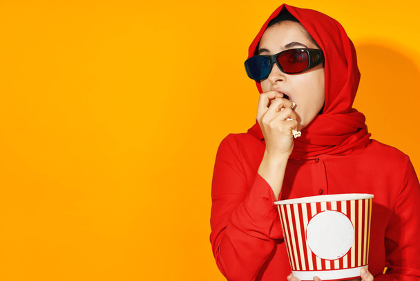 woman in red hijab popcorn entertainment cinema ethnicity model - Photo, Image