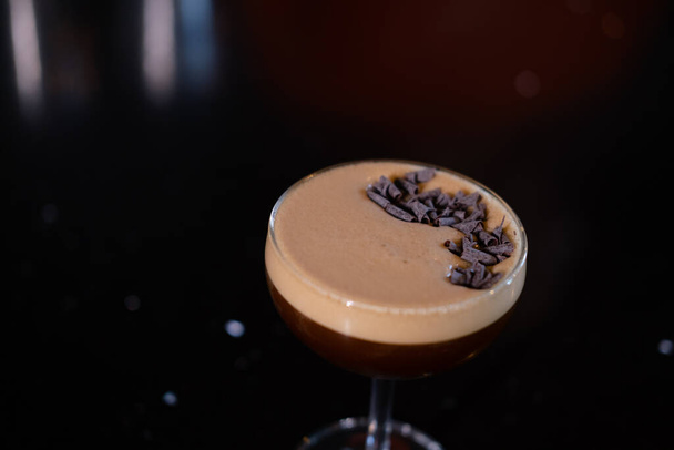 Espresso Martini cocktail garnished with grated chocolate. Alcohol cocktail. - Photo, Image