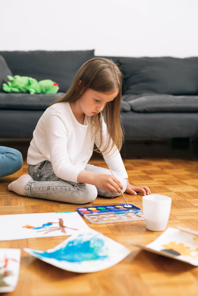 little girl painting with water colors at home - Fotó, kép