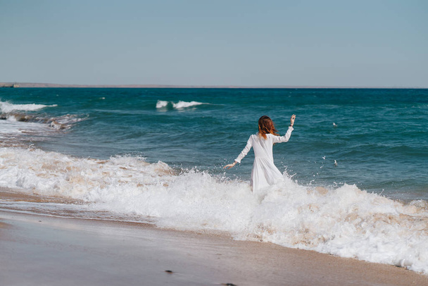 Woman in white dress near the ocean walk fresh air landscape - Fotoğraf, Görsel