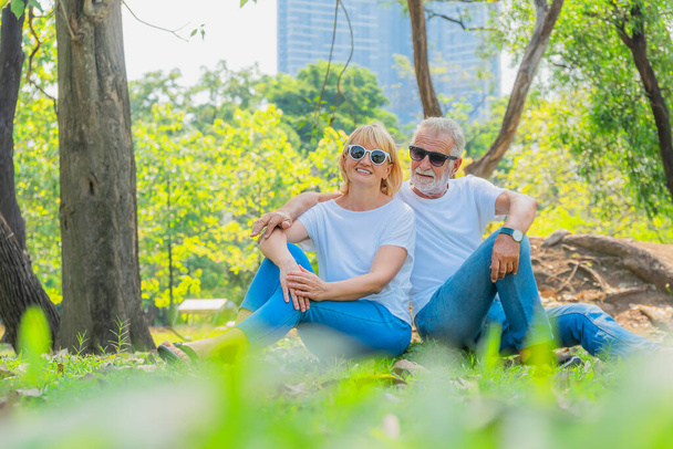caucasian senior couple happy together relaxing outdoor in park in summer - Photo, image