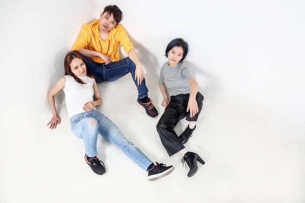 Group of young south east asian mixed woman chinese malay sit laying on white background floor moody tired - Foto, immagini
