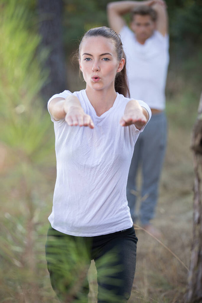 portrait of couple exercising outdoors - Photo, image