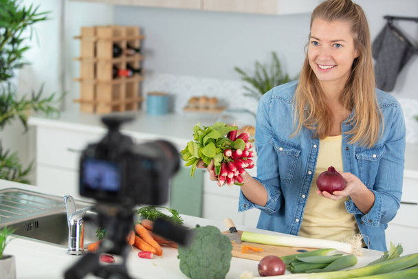 pretty female food blogger working on a new video - Photo, Image