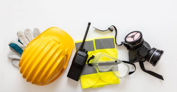 Work wear safety protection equipment isolated on white background, personal protective gear, top view. Industrial construction site health and safety concept - Photo, Image