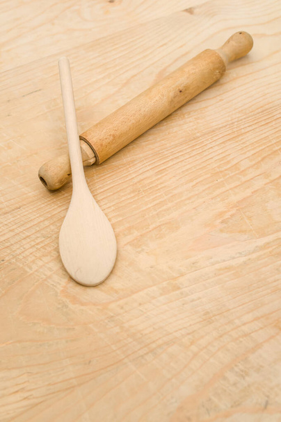 top view of wooden kitchen utensils on a wooden background with copy space - Фото, изображение