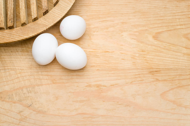 organic white eggs on a natural wooden tabletop surface with copy space for text - Photo, Image