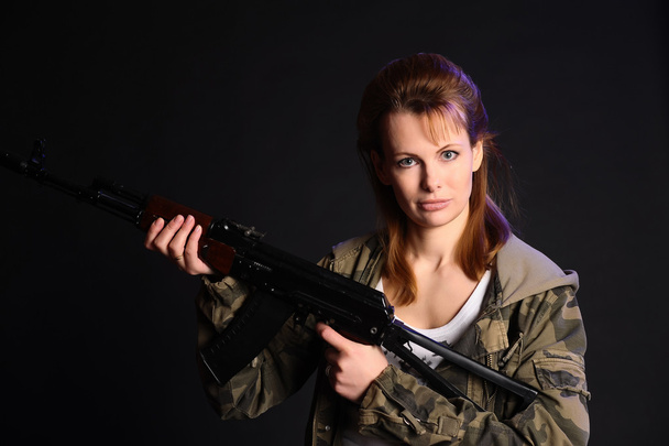 Woman with a gun - Фото, зображення