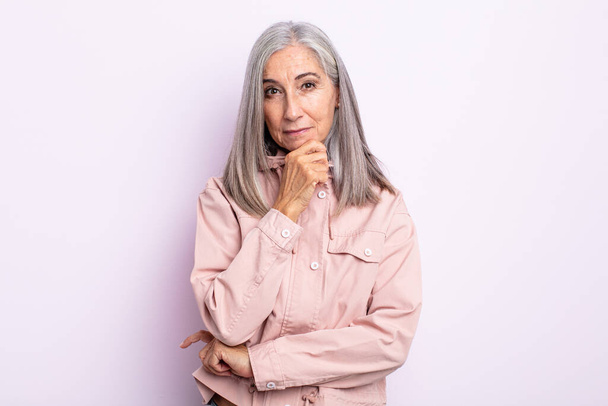 middle age gray hair woman looking serious, confused, uncertain and thoughtful, doubting among options or choices - Photo, Image