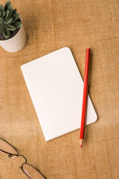 Empty notebook ready for mockup on wooden table, top view, flatlay. - Фото, изображение