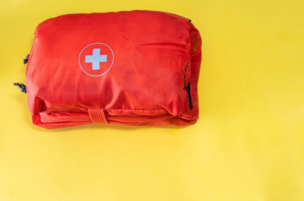  First aid kit isolated on yellow background - Photo, Image