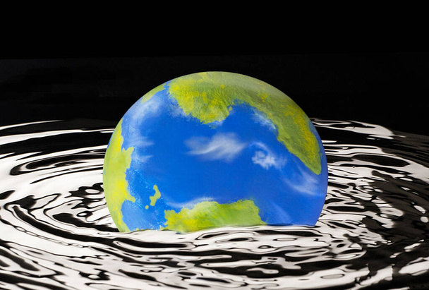 Planet earth globe flood risk on pollution damage concept. - Foto, Imagen