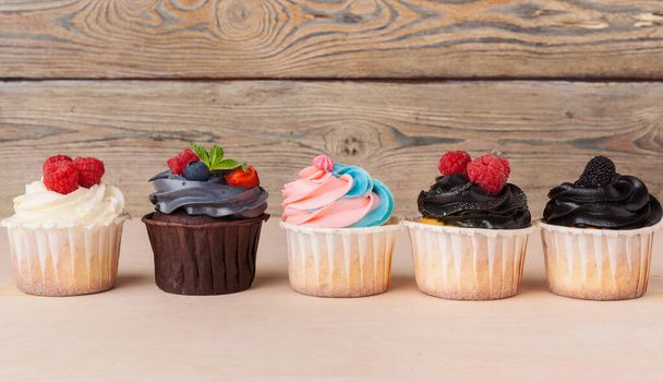 colorful cupcakes with different Tastes. Small beautifull cakes - Foto, Imagen