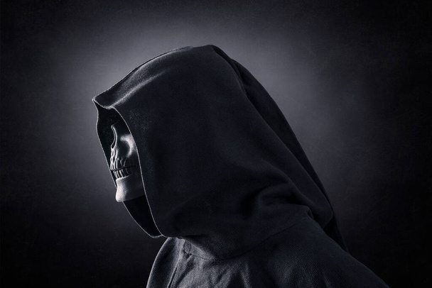 Grim reaper over dark misty background - Фото, зображення