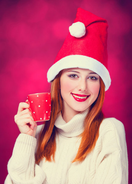 クリスマス帽子一杯で赤毛の女の子  - 写真・画像
