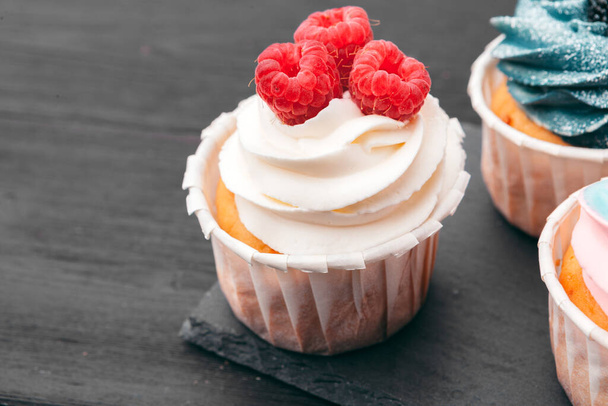 Set of different delicious cupcakes on dark - Foto, immagini
