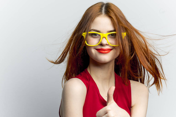 pretty woman yellow glasses hairstyle fashion close-up - 写真・画像