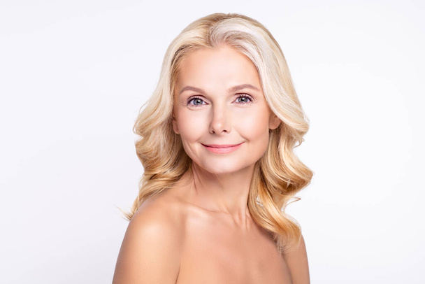 Portrait of attractive cheery grey-haired woman with pure clean clear smooth tanned skin isolated over white color background - Foto, Bild
