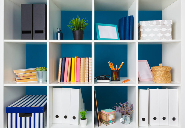 White office shelves with different stationery, close up - Fotoğraf, Görsel