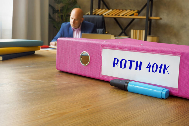 inscription ROTH 401K on the File Folder. White background. Businessman working with documents sending email, mobile phone - Photo, Image