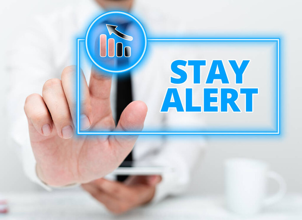 Text sign showing Stay Alert. Business approach Paying full attention to things around Quick to see or understand Presenting Communication Technology Smartphone Voice And Video Calling - Photo, Image