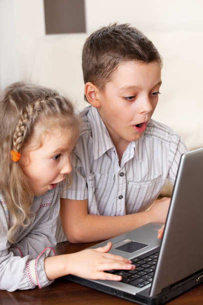 Surprised child with laptop - Fotó, kép