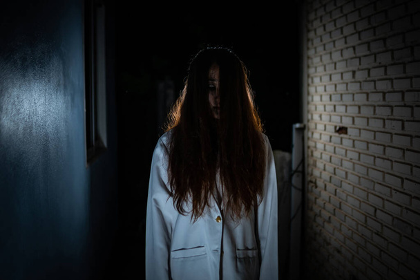 Scary ghost in white dress halloween theme - Фото, изображение
