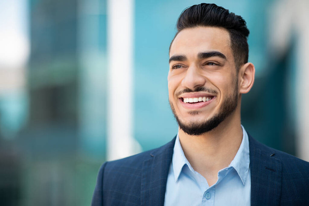 Closeup portrait of happy middle eastern young businessman, copy space - Photo, Image