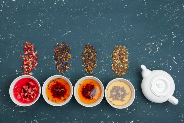 herbal tea in cups on a wooden background - Photo, Image