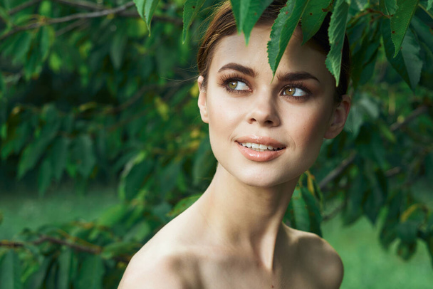 portrait of a woman green leaves clean skin nature summer Lifestyle - Foto, Imagen