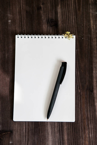  open white notebook on a dark wooden background    - Фото, зображення