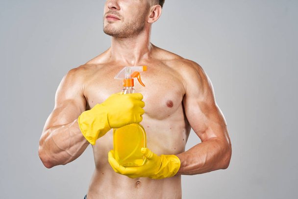 funny pumped up man rubber gloves detergents service - Foto, Imagem