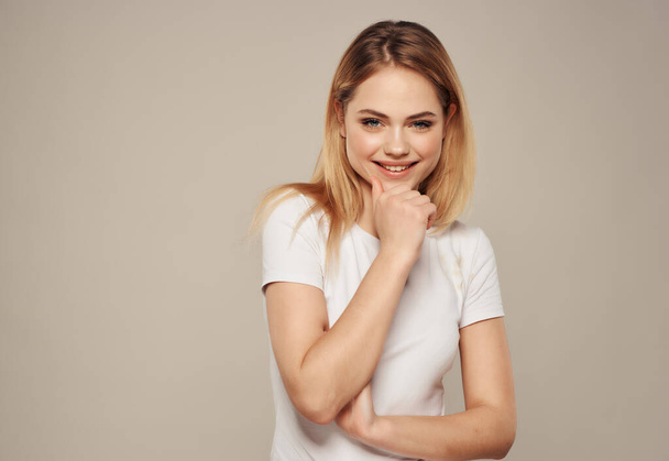 beautiful blonde in a white posing on  isolated background. High quality photo - Fotoğraf, Görsel
