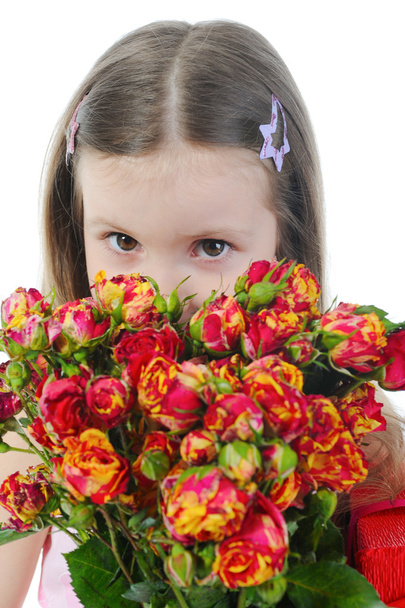Little girl with a rose. - Foto, Imagen