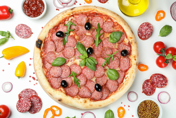 Concept of tasty food with Salami pizza on white background - Photo, Image