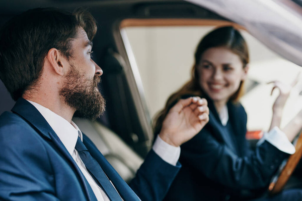 business man and woman driving a car transport - Photo, Image