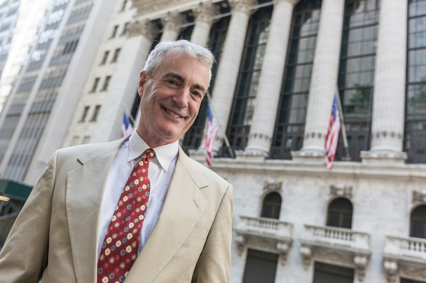 Senior Businessman in front of Wall Street Stock Exchange - Photo, Image